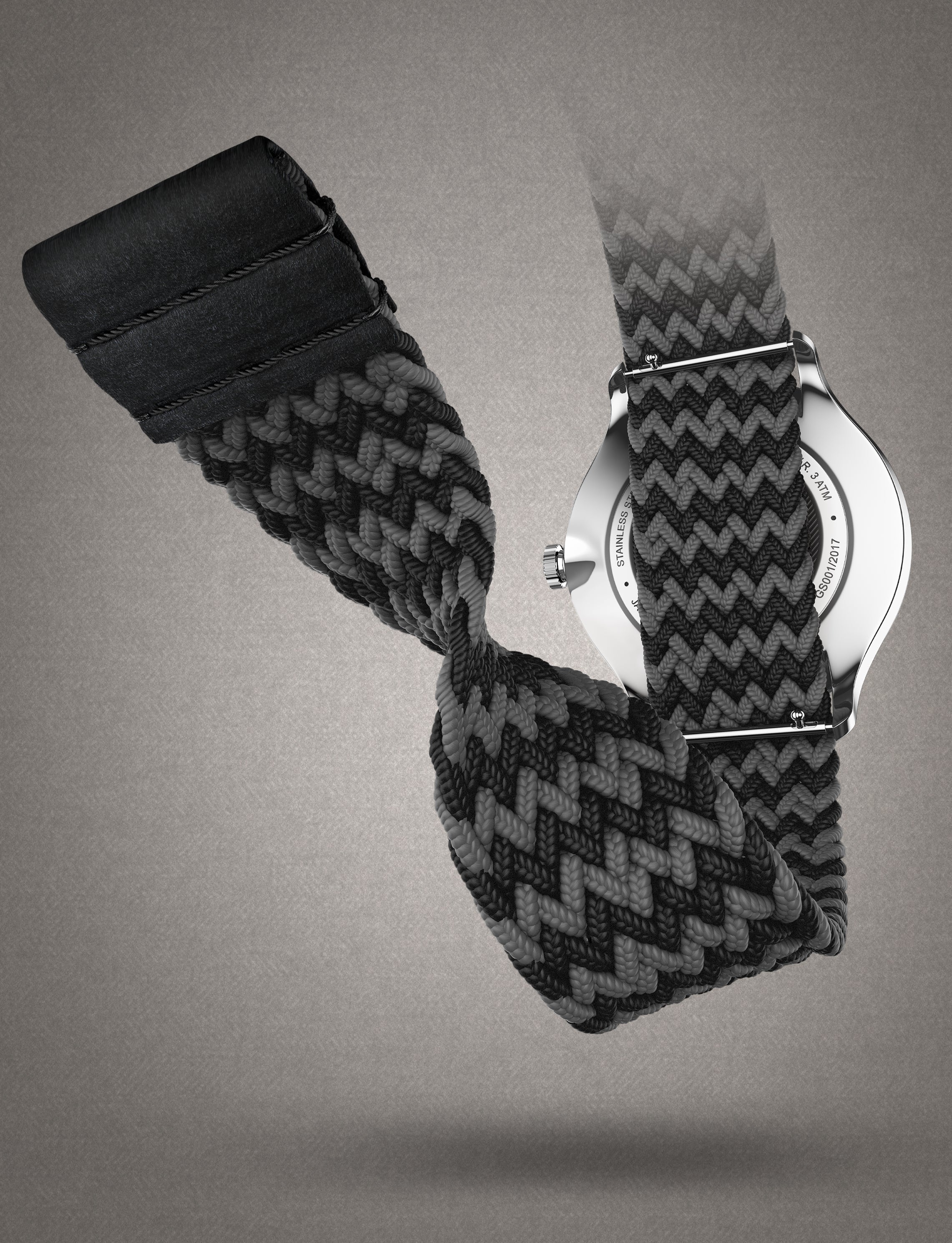 Montre Tweed Co. avec bracelet tressé extensible Marty, noir et gris, design élégant et ajustement parfait au poignet