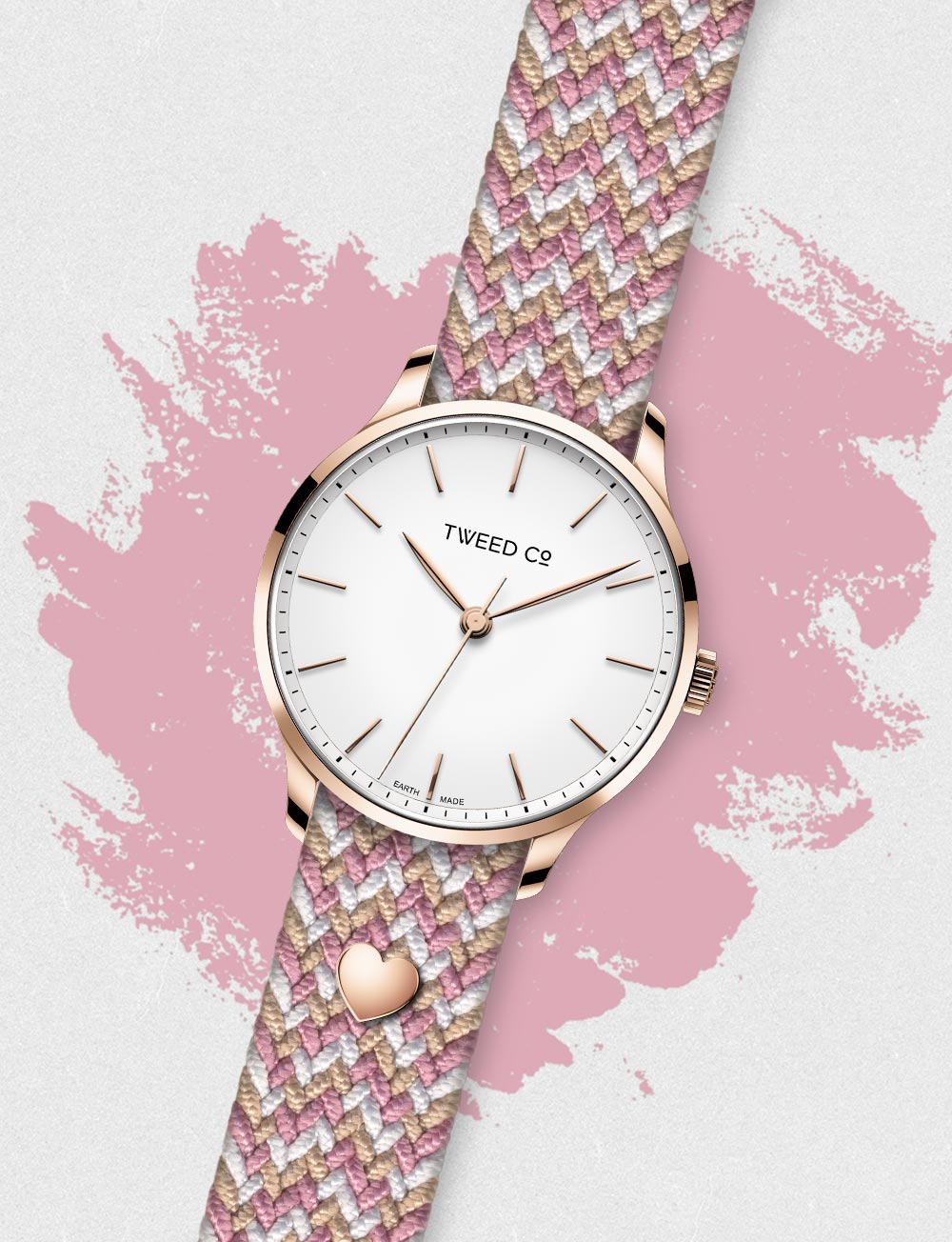 Montre Rose - Or Rose - 36 mm avec bracelet tressé rose et blanc, élégamment posée pour refléter féminité et raffinement